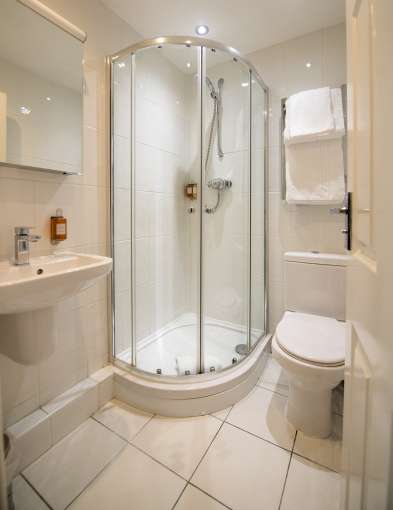 white bathroom with standing shower