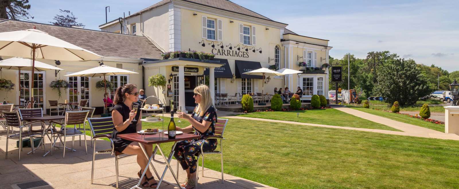 Devon Hotel Carriages Restaurant Guests Enjoying Afternoon Tea with Prosecco Outdoors on Lawn Terrace