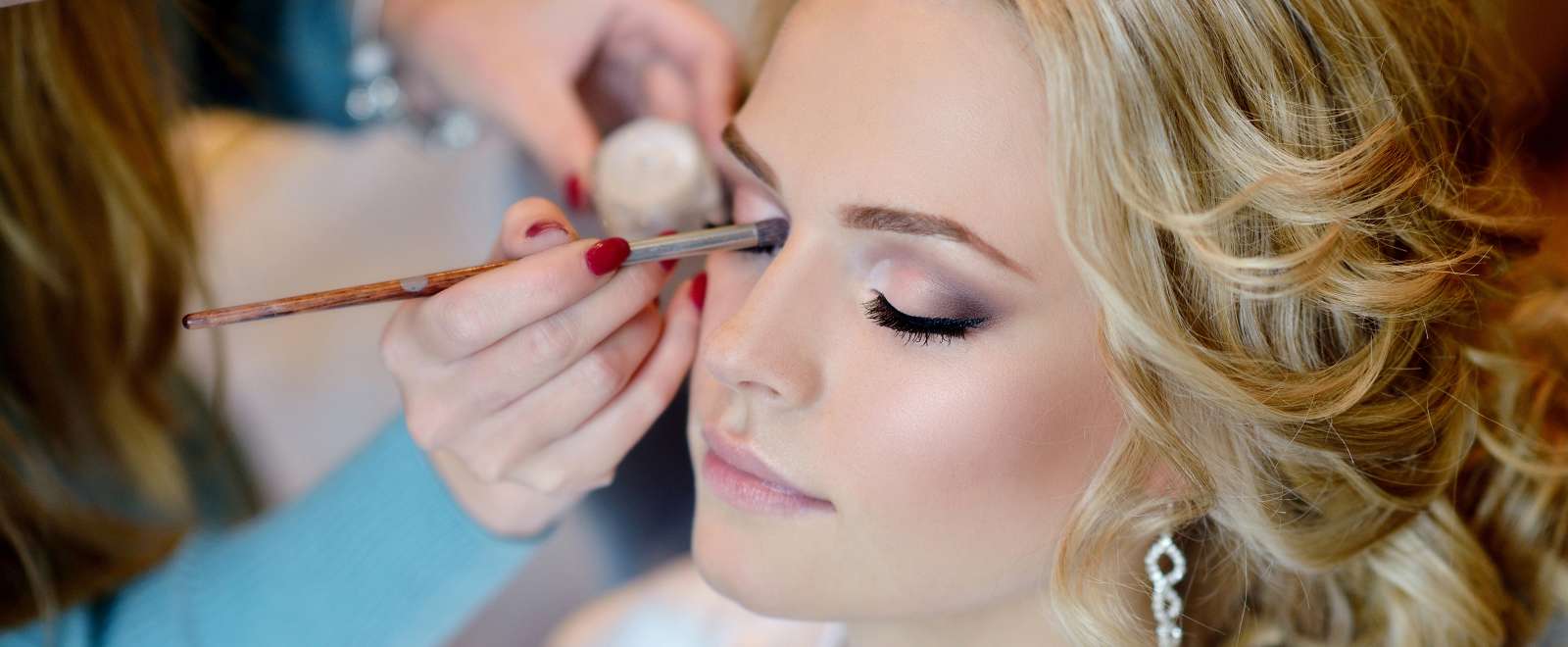 Bride getting ready for the wedding with make up