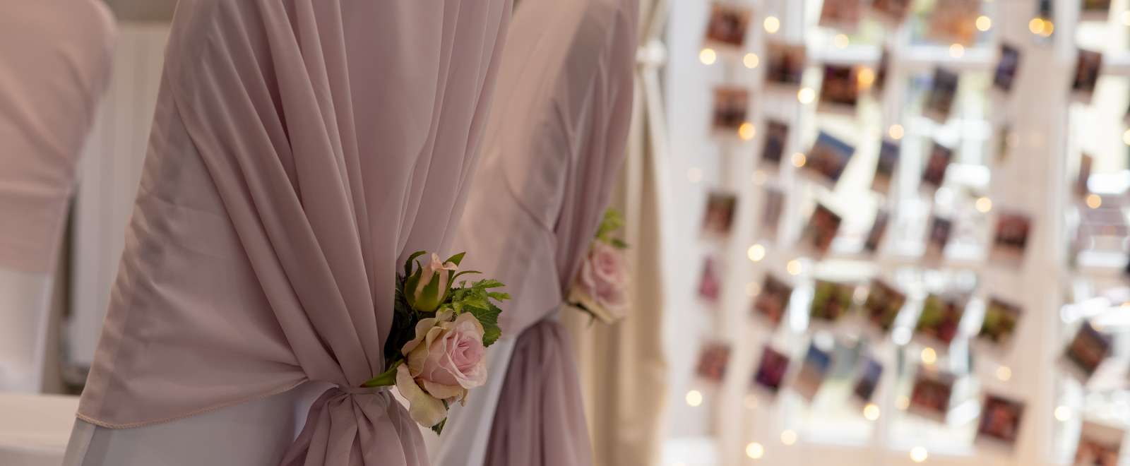 chairs with wedding covers and flowers