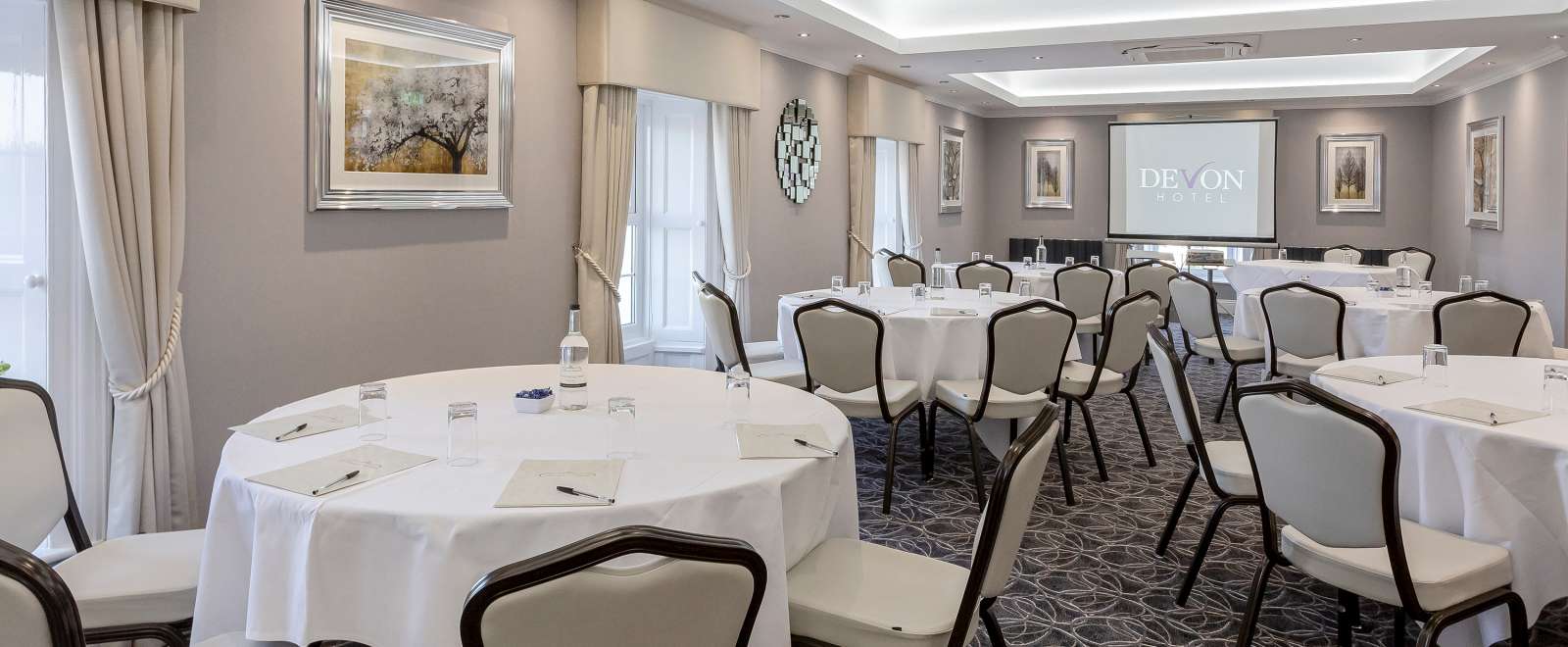 tables laid out in cabaret format for a meeting