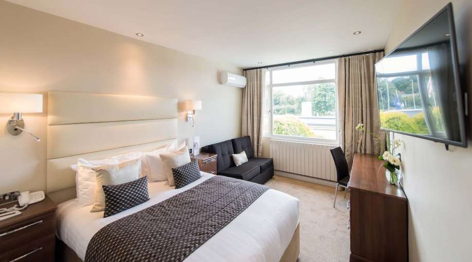 Devon Hotel Accommodation (203) Bed with Desk and Seating Area