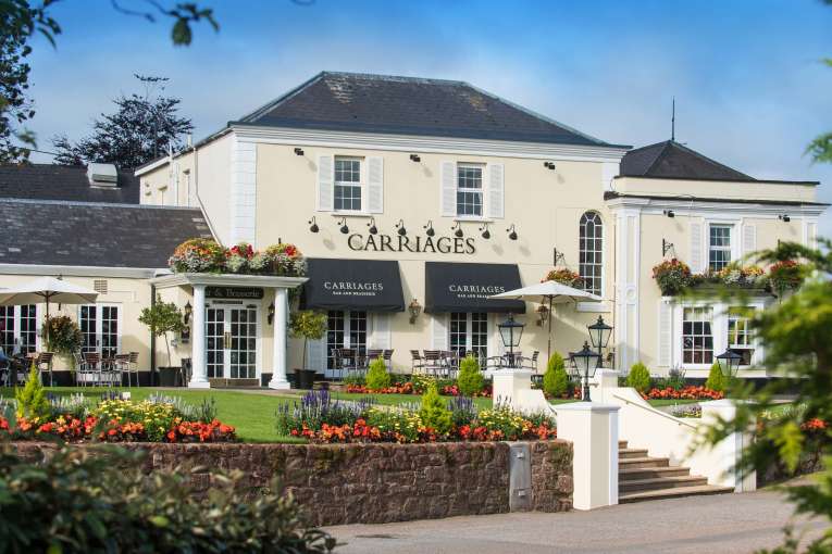 Devon Hotel Carriages Restaurant Exterior with Flowers