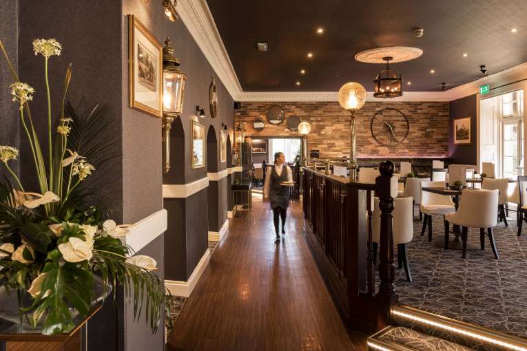 Devon Hotel Carriages Restaurant Waitress in Dining Area