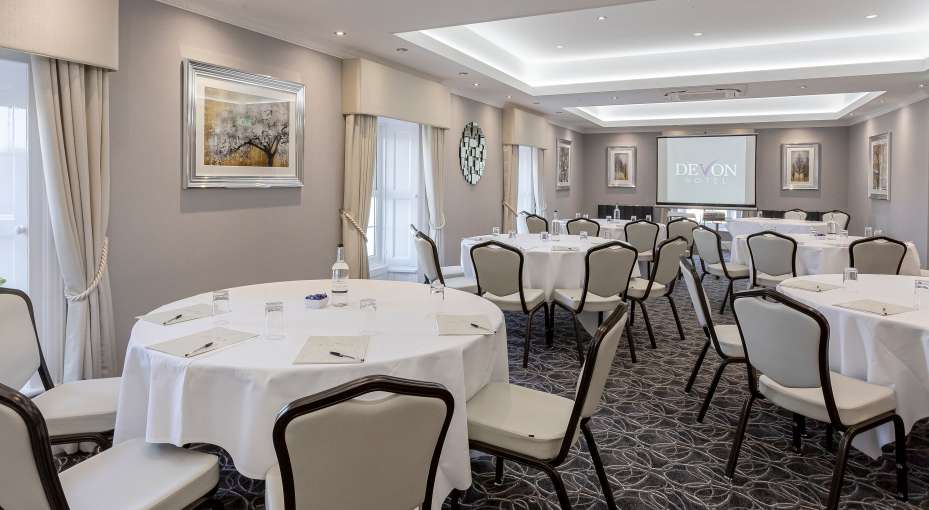 tables laid out in cabaret format for a meeting