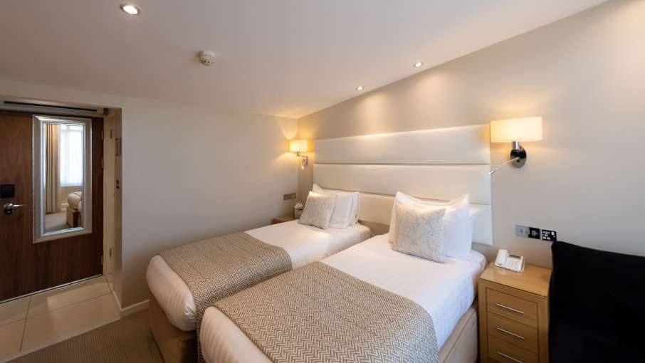 twin beds in hotel room at Devon Hotel