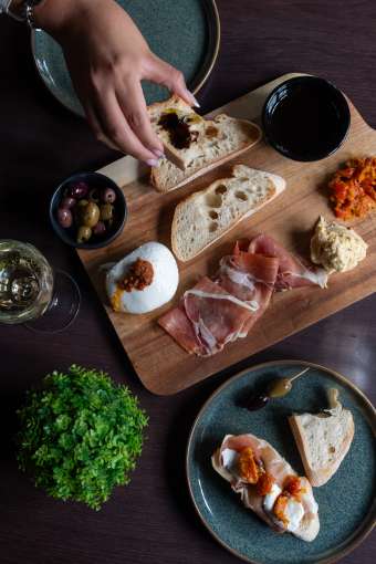 Landy Enjoying Sharing Board at The Devon Hotel