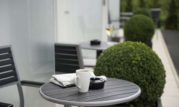 Devon Hotel Accommodation Outdoor Patio Area Table with Coffee and Newspaper