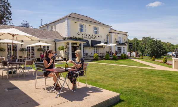 Devon Hotel Carriages Restaurant Guests Enjoying Afternoon Tea with Prosecco Outdoors on Lawn Terrace