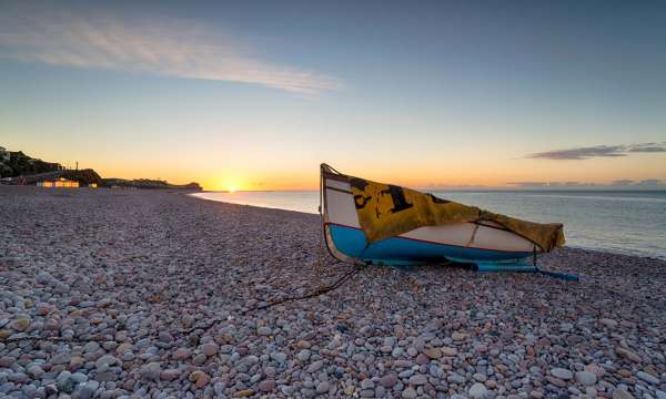 Sunrise Over Boat on Beach at Budleigh Salterton South Devon