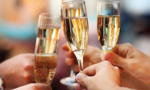 Wedding guests making a toast with champagne