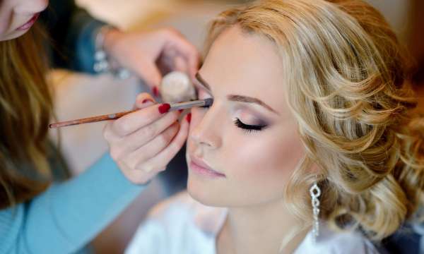 Bride getting ready for the wedding with make up
