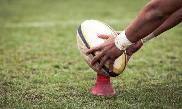 rugby ball being held