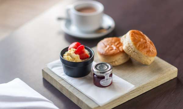 Cream tea, tub of jam and clotted cream 