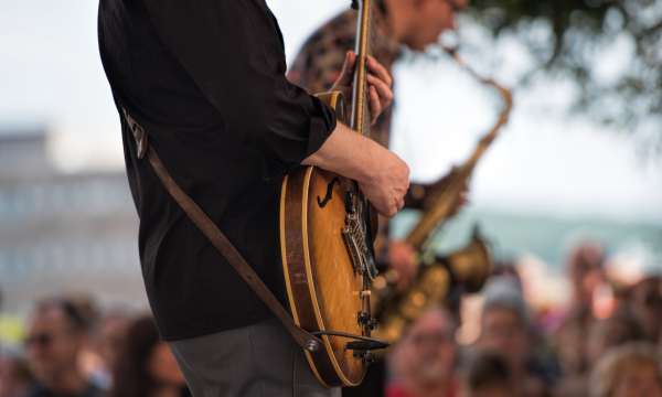 Person Playing the Guitar