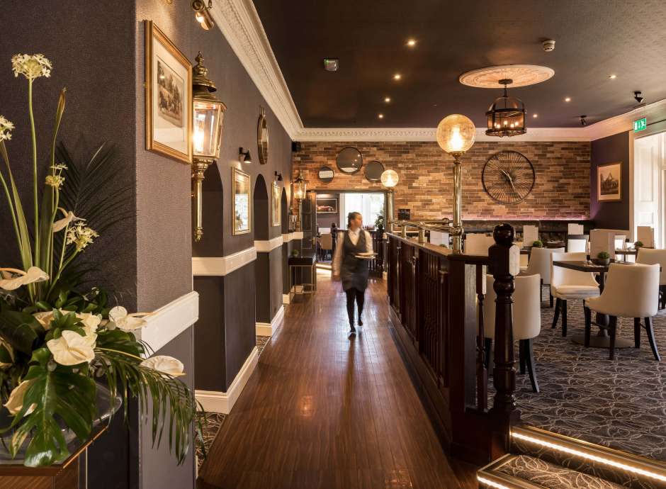 Devon Hotel Carriages Restaurant Waitress in Dining Area