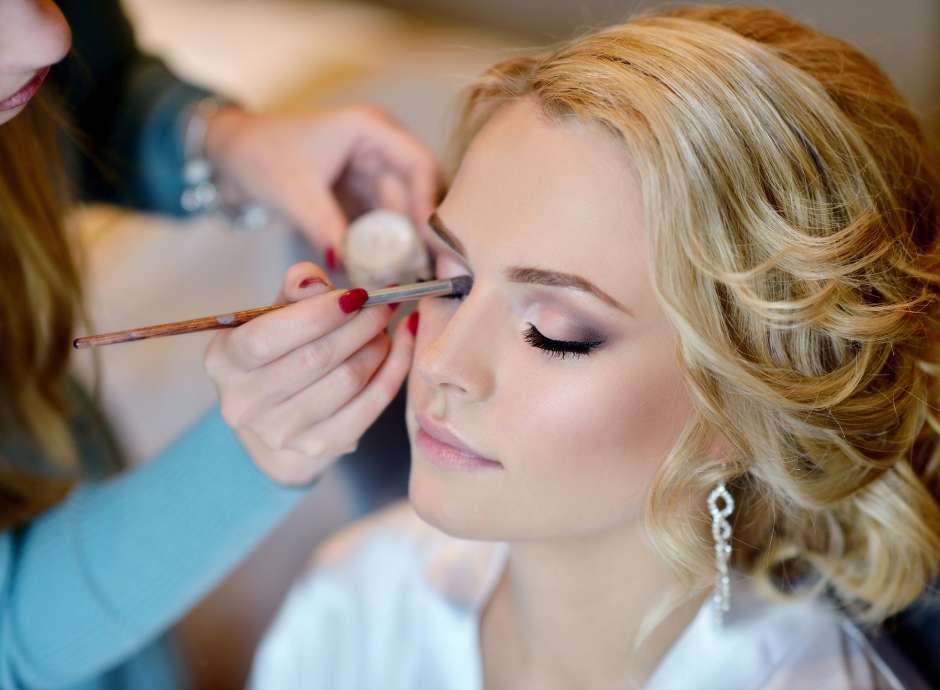 Bride getting ready for the wedding with make up