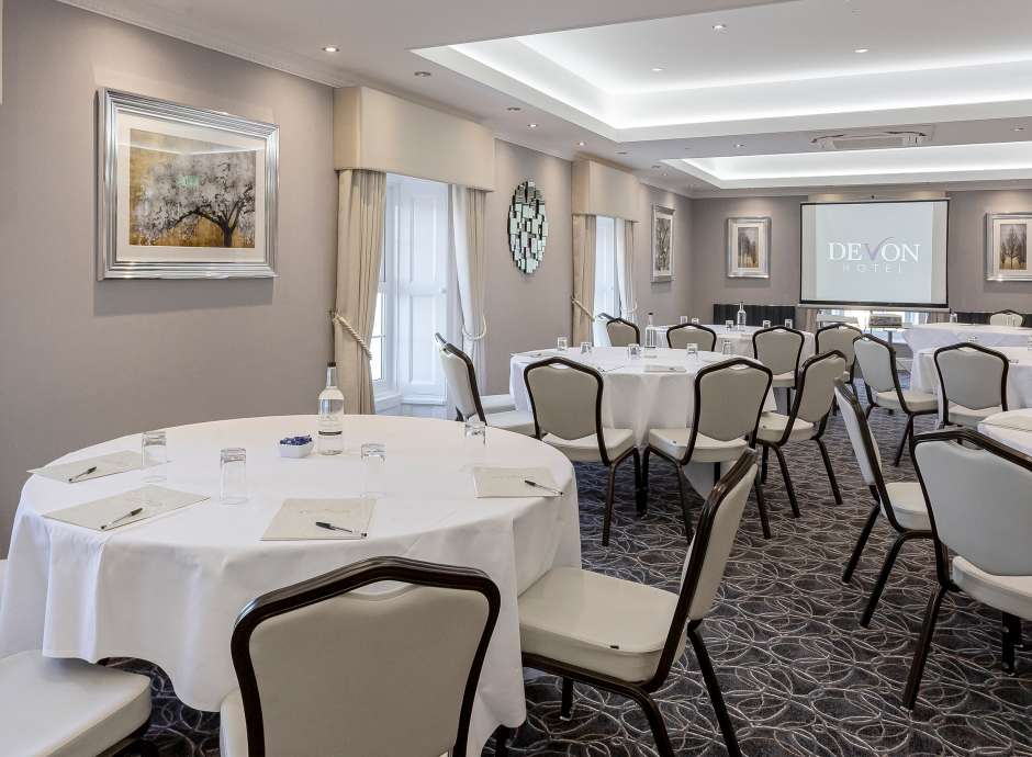 tables laid out in cabaret format for a meeting