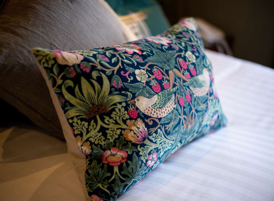 Decorative cushion on bed