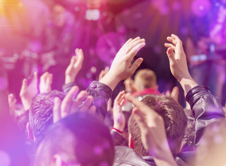 People dancing at a concert 