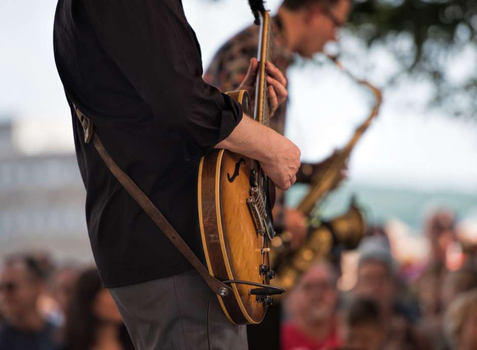 Person Playing the Guitar